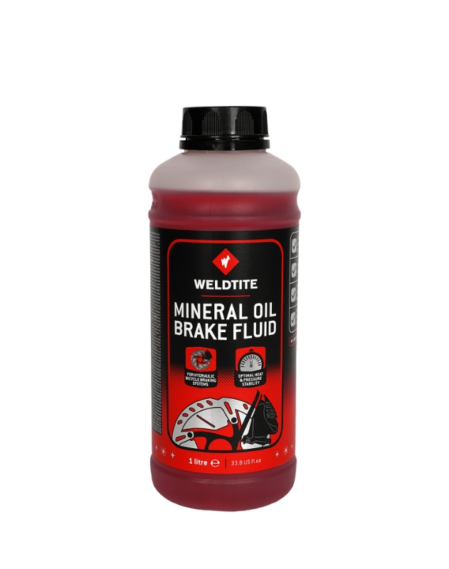 Bremsevæske Mineralsk (1L) fra Weldtite. Dunken  har bred hals, så en sprøjte passer direkte ned i  dunken.