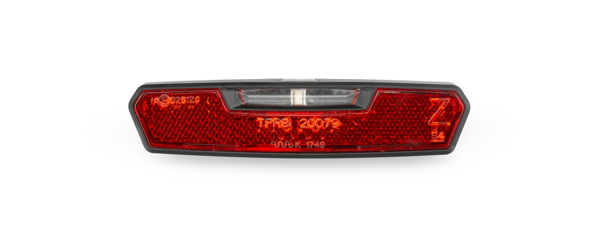 AXA baglygte JUNO E m. refleks til elcykler.  DC 6-12 V spændingsvidde. Monteres på bagage- bærer (hulafstand 50 mm).  Lev.uden ledning.